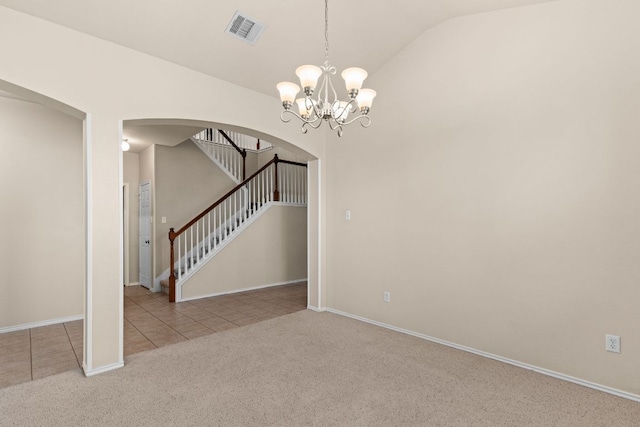5405 English Oak Dr, Killeen, TX 76542 - carpeted spare room featuring an inviting chandelier, arched walkways, tile patterned flooring, vaulted ceiling, and visible vents