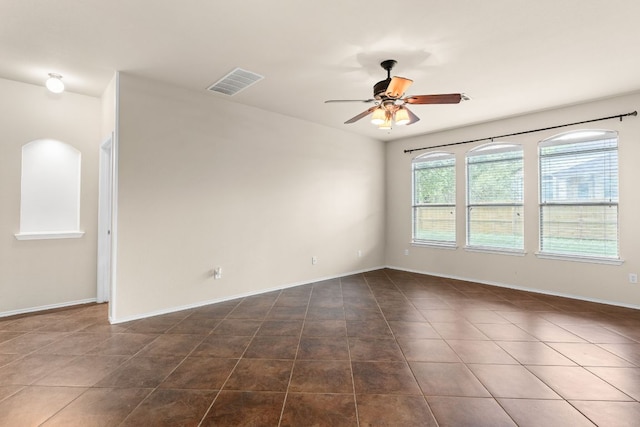 5405 English Oak Dr, Killeen, TX 76542 - unfurnished room with dark tile patterned floors, visible vents, baseboards, and ceiling fan