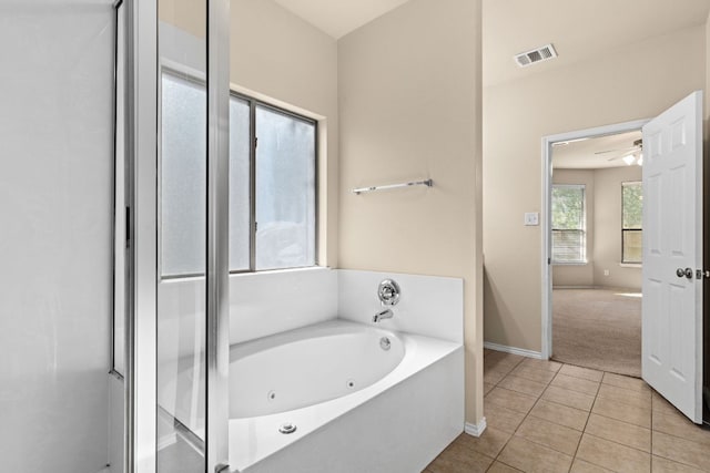 5405 English Oak Dr, Killeen, TX 76542 - full bathroom with visible vents, baseboards, ceiling fan, a whirlpool tub, and tile patterned floors