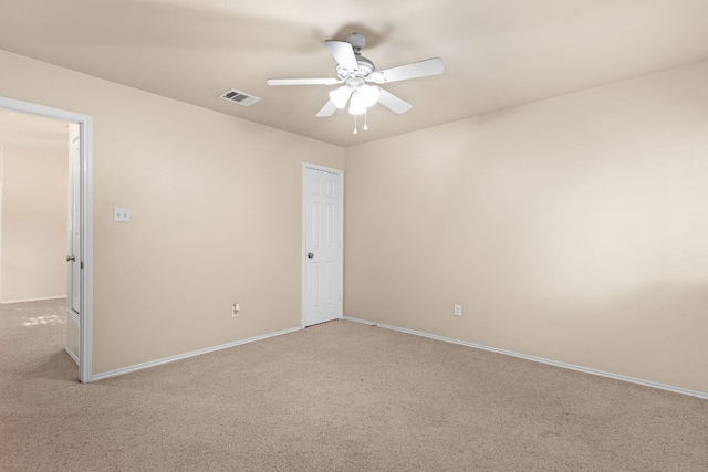 5405 English Oak Dr, Killeen, TX 76542 - unfurnished room featuring visible vents, ceiling fan, light carpet, and baseboards