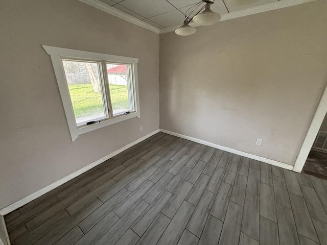 1008 W Pietzsch St, Bartlett, TX 76511 - spare room featuring dark wood-style flooring, ornamental molding, and baseboards