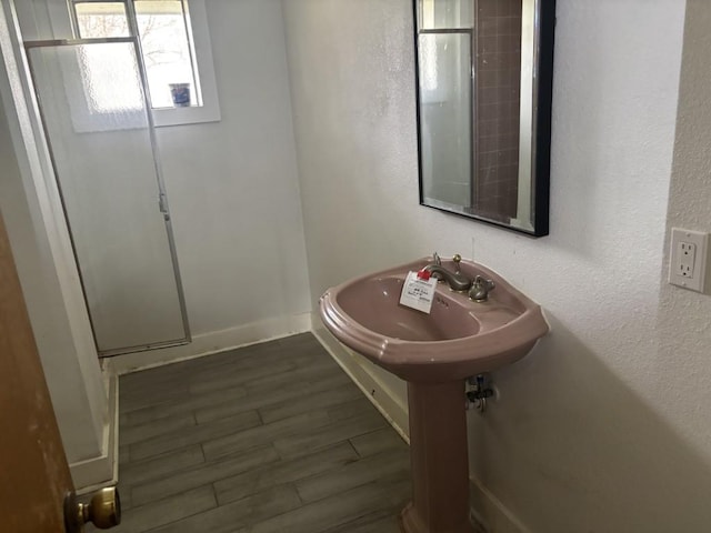 1008 W Pietzsch St, Bartlett, TX 76511 - bathroom with wood finished floors and baseboards