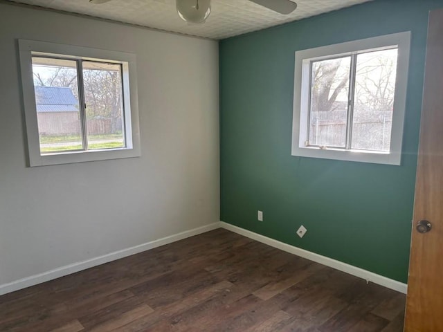1008 W Pietzsch St, Bartlett, TX 76511 - unfurnished room featuring ceiling fan, dark wood-style flooring, and baseboards