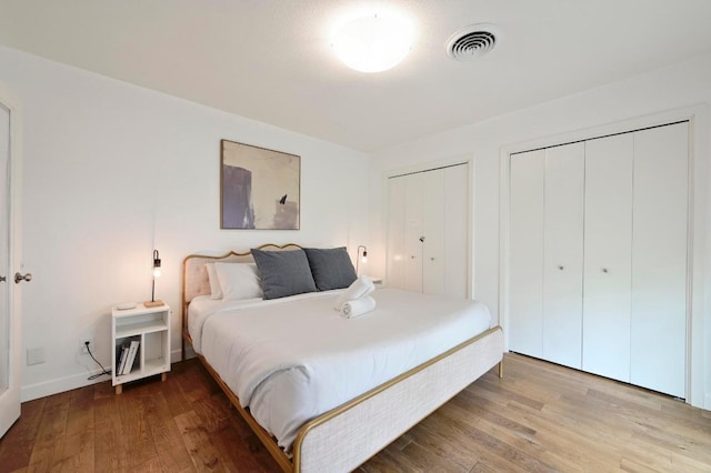 2301 Trafalgar Dr, Austin, TX 78723 - bedroom with wood finished floors and two closets