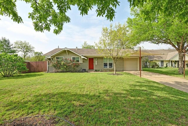 2301 Trafalgar Dr, Austin, TX 78723 - ranch-style home featuring a garage, driveway, and brick siding