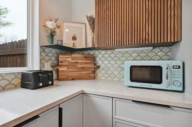 2301 Trafalgar Dr, Austin, TX 78723 - kitchen view of decorative backsplash and light countertops