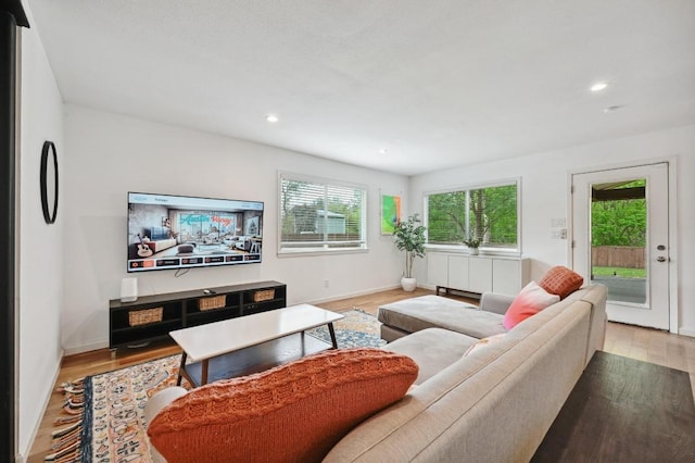 2301 Trafalgar Dr, Austin, TX 78723 - living room featuring light wood-style floors and recessed lighting