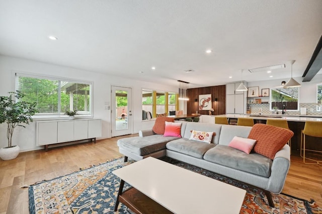 2301 Trafalgar Dr, Austin, TX 78723 - living room featuring light wood finished floors and recessed lighting