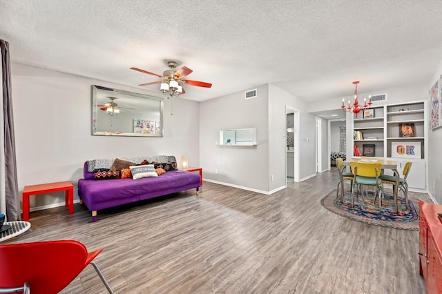 2425 Ashdale Dr Unit 78, Austin, TX 78757 - bedroom featuring visible vents, a textured ceiling, baseboards, and wood finished floors