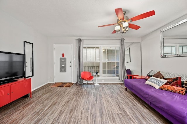 2425 Ashdale Dr Unit 78, Austin, TX 78757 - living room with baseboards, a ceiling fan, and wood finished floors