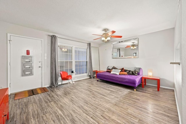 2425 Ashdale Dr Unit 78, Austin, TX 78757 - interior space featuring a textured ceiling, wood finished floors, and a ceiling fan