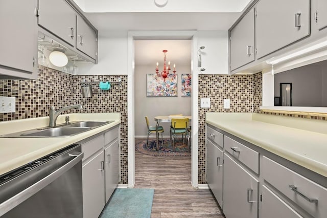 2425 Ashdale Dr Unit 78, Austin, TX 78757 - kitchen with light wood finished floors, stainless steel dishwasher, a sink, and light countertops