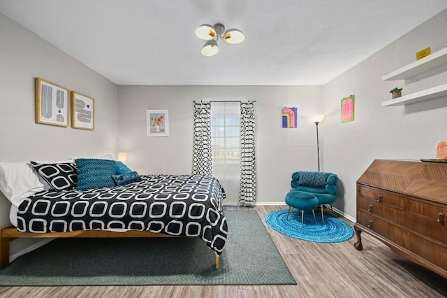 2425 Ashdale Dr Unit 78, Austin, TX 78757 - bedroom with baseboards and wood finished floors