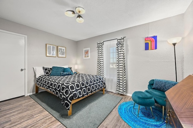 2425 Ashdale Dr Unit 78, Austin, TX 78757 - bedroom with baseboards and wood finished floors