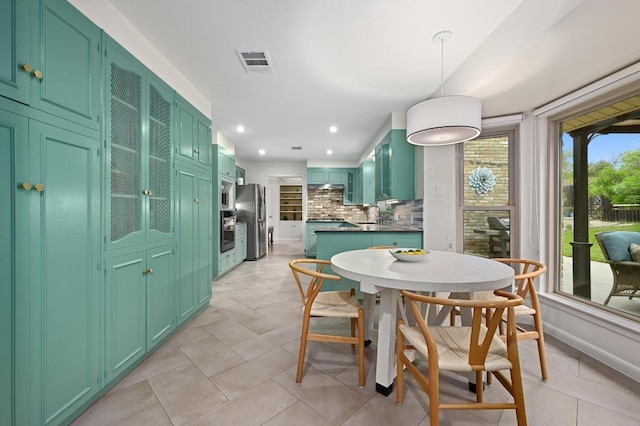 5708 Bullard Dr, Austin, TX 78757 - dining area featuring light tile patterned floors, recessed lighting, and visible vents