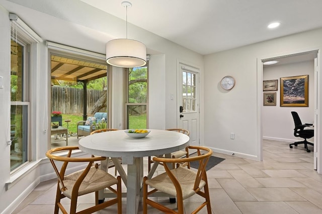 5708 Bullard Dr, Austin, TX 78757 - dining room featuring light tile patterned floors, baseboards, and recessed lighting