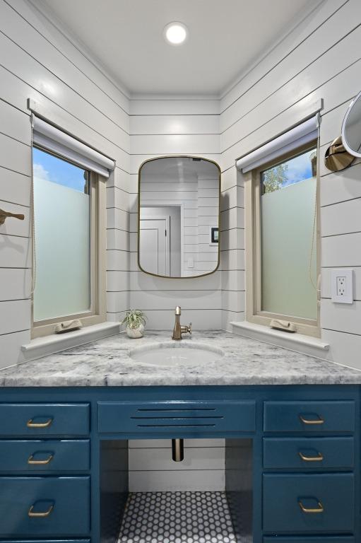 5708 Bullard Dr, Austin, TX 78757 - bathroom with wooden walls and vanity