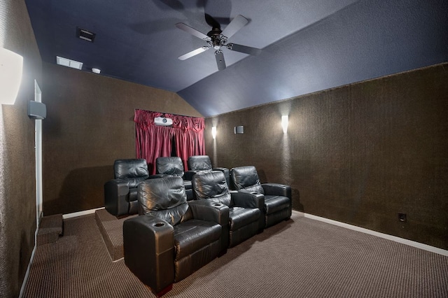 cinema room featuring ceiling fan, lofted ceiling, carpet flooring, and visible vents