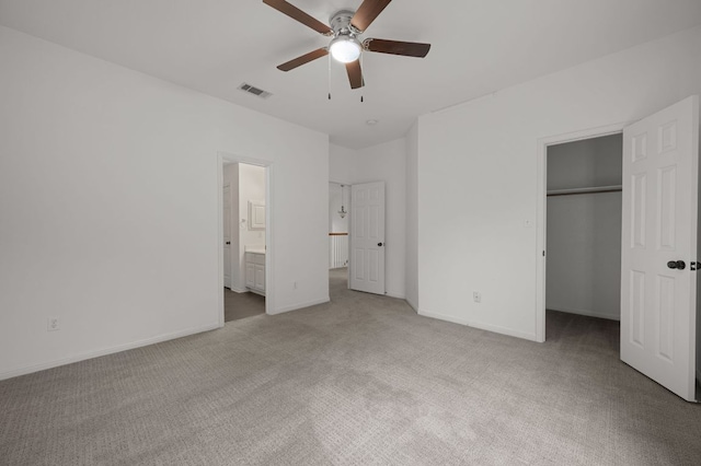 1606 Buttercup Creek Blvd, Cedar Park, TX 78613 - unfurnished bedroom featuring carpet floors, a spacious closet, a closet, connected bathroom, and baseboards