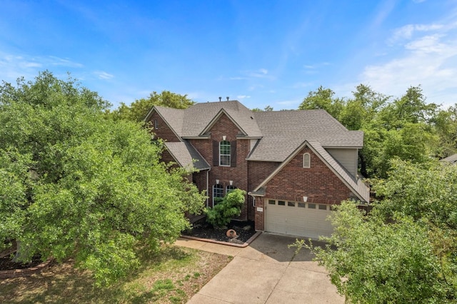 1606 Buttercup Creek Blvd, Cedar Park, TX 78613 - traditional home with concrete driveway, an attached garage, roof with shingles, and brick siding