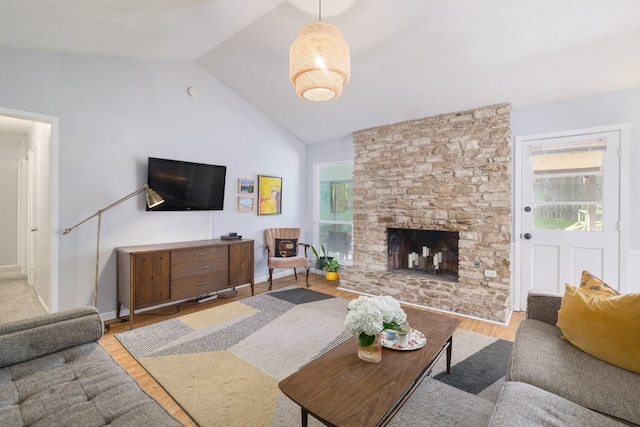 9605 Marston Ln, Austin, TX 78753 - living room with lofted ceiling, wood finished floors, and a fireplace