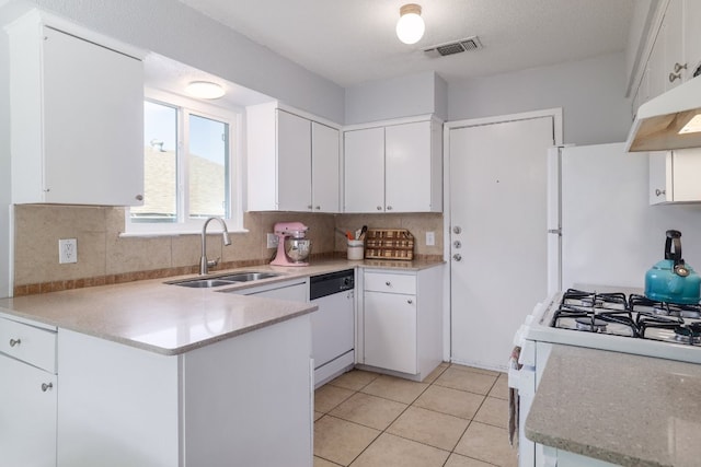 9605 Marston Ln, Austin, TX 78753 - kitchen with a sink, white appliances, a peninsula, and white cabinetry