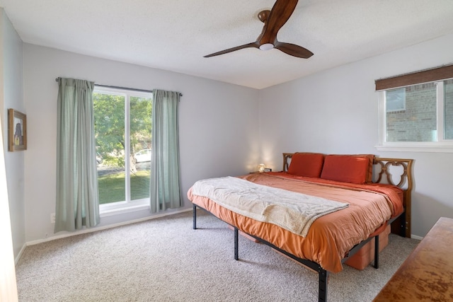 9605 Marston Ln, Austin, TX 78753 - bedroom with carpet, a ceiling fan, and baseboards