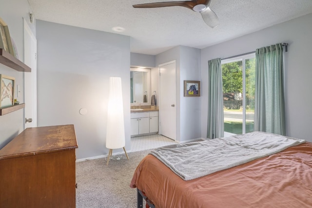 9605 Marston Ln, Austin, TX 78753 - bedroom featuring a textured ceiling, baseboards, ensuite bath, light colored carpet, and ceiling fan