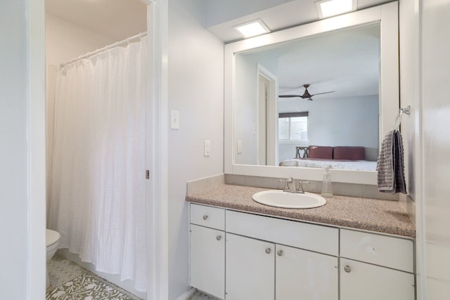 9605 Marston Ln, Austin, TX 78753 - ensuite bathroom with toilet, vanity, and ceiling fan