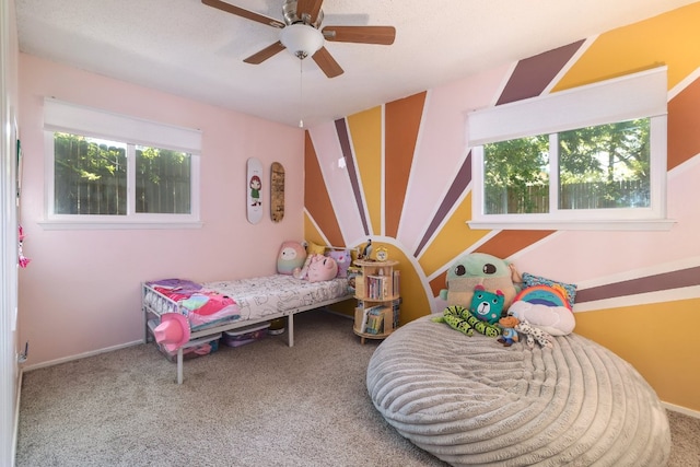 9605 Marston Ln, Austin, TX 78753 - bedroom featuring multiple windows, carpet floors, and a ceiling fan
