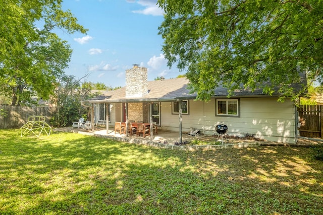 9605 Marston Ln, Austin, TX 78753 - rear view of property featuring a chimney and a patio