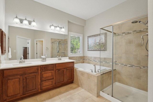 full bathroom featuring a garden tub, a sink, a stall shower, double vanity, and tile patterned flooring