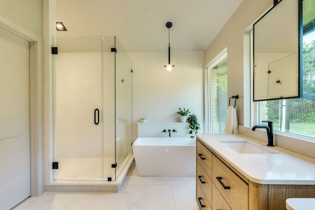 9909 Oliver Dr, Austin, TX 78736 - full bathroom with vanity, a freestanding tub, a stall shower, and healthy amount of natural light