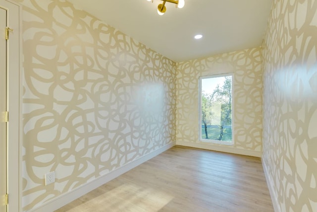 9909 Oliver Dr, Austin, TX 78736 - unfurnished room with wallpapered walls, wood finished floors, and recessed lighting