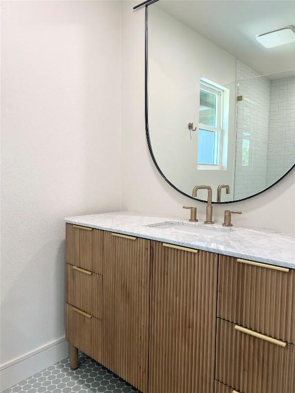 9909 Oliver Dr, Austin, TX 78736 - bathroom featuring vanity and baseboards
