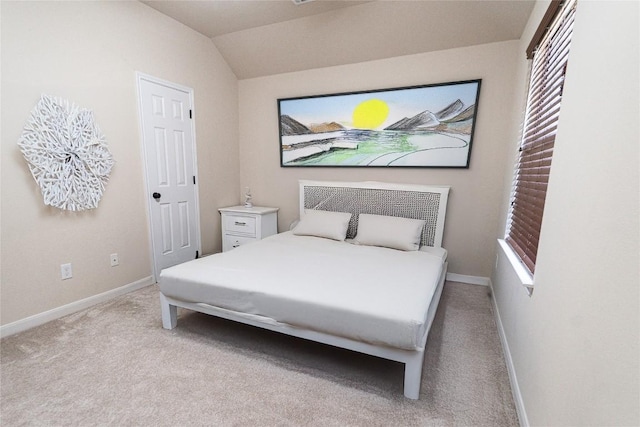 121 E Adelanta Pl, Round Rock, TX 78681 - bedroom with baseboards, light carpet, and vaulted ceiling