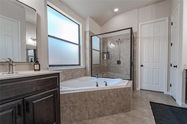 121 E Adelanta Pl, Round Rock, TX 78681 - bathroom featuring a garden tub, vanity, tiled shower, vaulted ceiling, and tile patterned floors