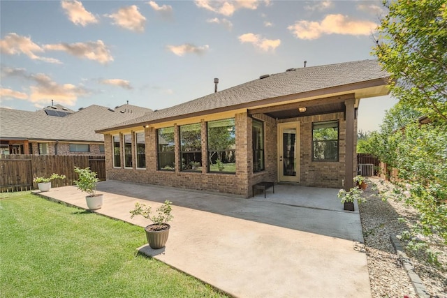 121 E Adelanta Pl, Round Rock, TX 78681 - rear view of property featuring brick siding, a patio area, and central air condition unit