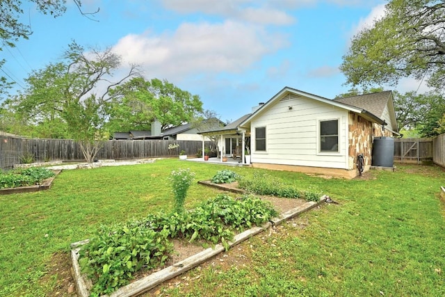 6567 Fair Valley Trl, Austin, TX 78749 - fenced backyard featuring a vegetable garden and a patio