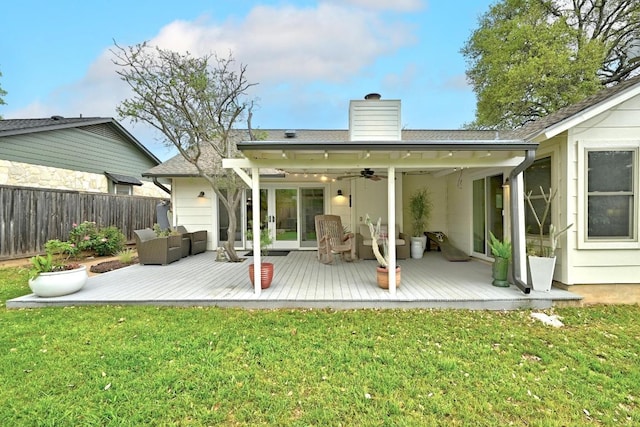 6567 Fair Valley Trl, Austin, TX 78749 - rear view of house featuring a wooden deck, a ceiling fan, a chimney, and an outdoor living space
