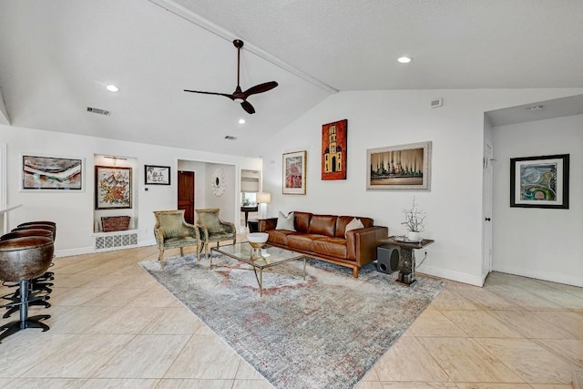 6567 Fair Valley Trl, Austin, TX 78749 - living room with ceiling fan, vaulted ceiling, light tile patterned floors, and recessed lighting