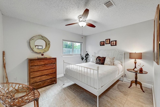 6567 Fair Valley Trl, Austin, TX 78749 - bedroom featuring a textured ceiling and a ceiling fan