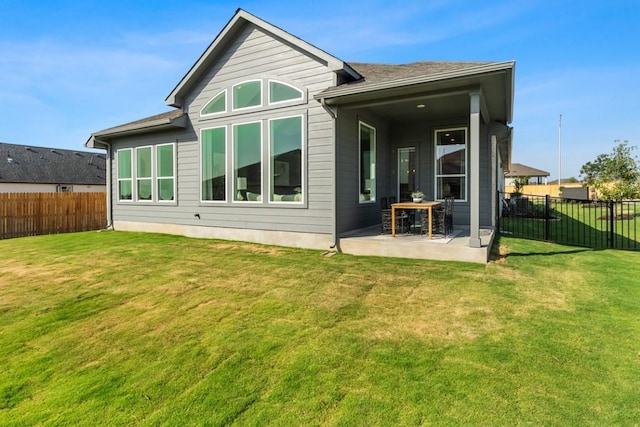 13615 Thomas Wheeler Way, Manor, TX 78653 - rear view of house with a patio area