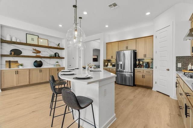 13615 Thomas Wheeler Way, Manor, TX 78653 - kitchen featuring stainless steel appliances, backsplash, a breakfast bar, open shelves, and recessed lighting