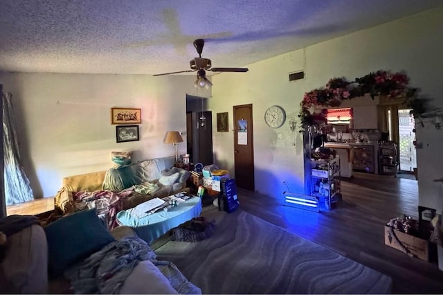 5501 Hibiscus Dr, Austin, TX 78724 - living area featuring ceiling fan, a textured ceiling, and wood finished floors