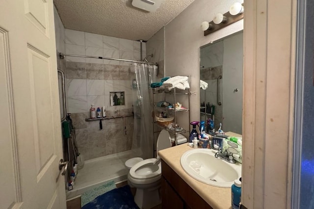 5501 Hibiscus Dr, Austin, TX 78724 - bathroom featuring a textured ceiling, a stall shower, and vanity