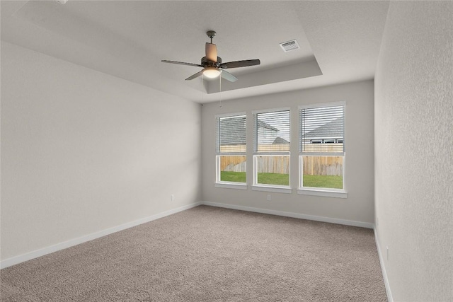 13504 Thomas Wheeler Way, Manor, TX 78653 - empty room featuring carpet floors, ceiling fan, baseboards, and a textured wall