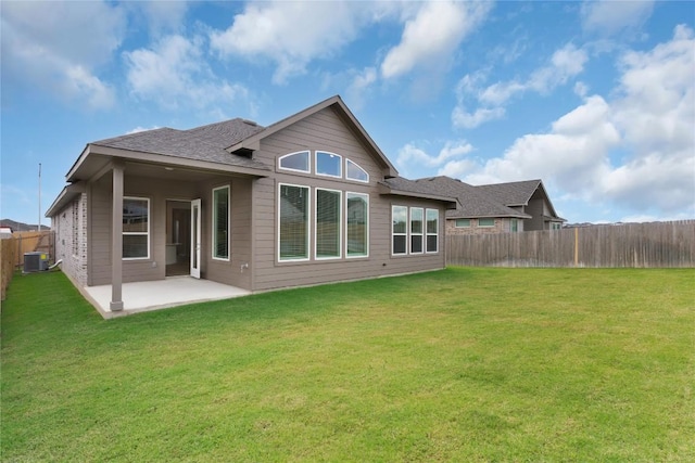 13504 Thomas Wheeler Way, Manor, TX 78653 - back of house with central AC, a patio, and roof with shingles