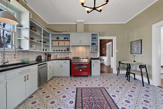 2124 Bluebonnet Ln, Austin, TX 78704 - kitchen featuring appliances with stainless steel finishes, open shelves, dark countertops, a chandelier, and crown molding