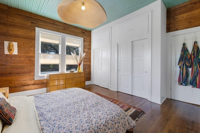 2124 Bluebonnet Ln, Austin, TX 78704 - bedroom with wooden walls and dark wood finished floors